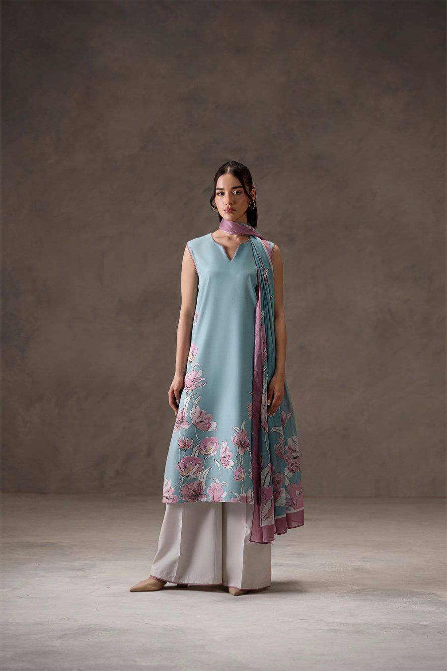 Saffora, a sleeveless light blue silk lawn 3-piece suit by Jahaan